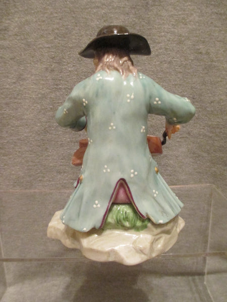 K & C Prag Porcelaine Figure d'un joueur de vielle à roue, 19ème C Rare