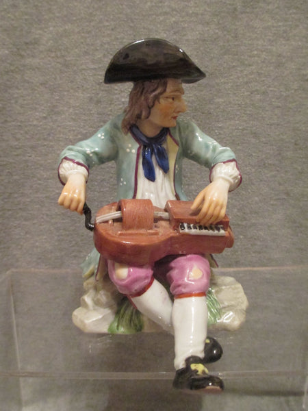K & C Prag Porcelaine Figure d'un joueur de vielle à roue, 19ème C Rare