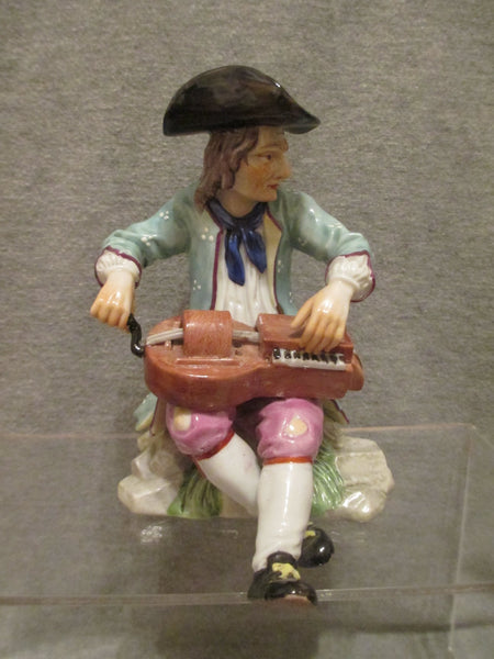 K & C Prag Porcelaine Figure d'un joueur de vielle à roue, 19ème C Rare