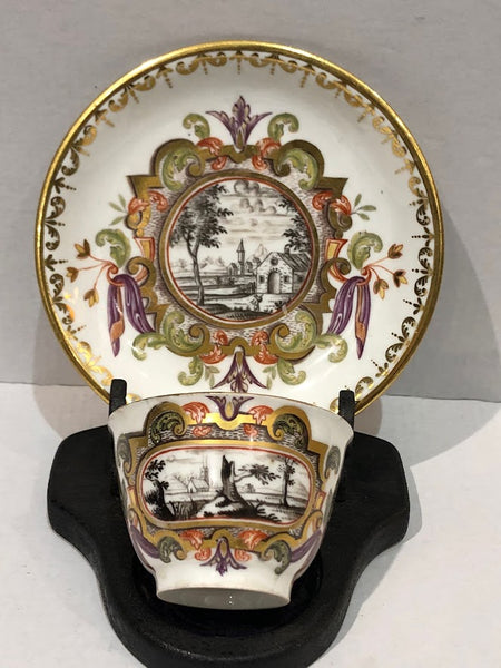 Meissen Porcelain Hausmaler Tea Bowl & Saucer with Landscape Scenes, circa 1740