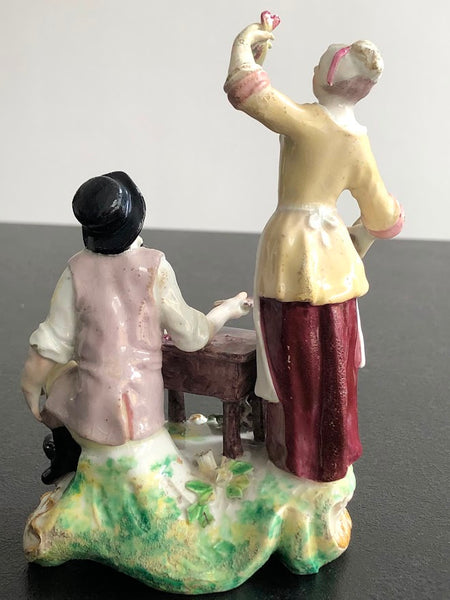 A rare Chelsea figure group of the fish seller and his wife, c.1756-57
