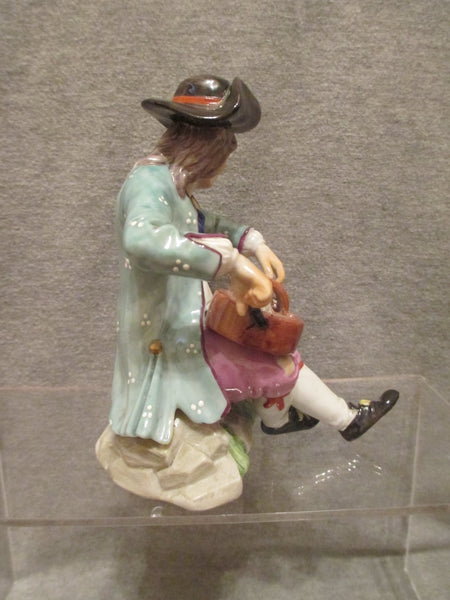 K & C Prag Porcelain Figure of a Hurdy Gurdy Player, 19th C Rare