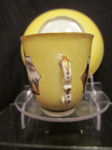 Meissen Yellow Ground Scenic Beaker and Saucer. Dating between 1735 - 1740.