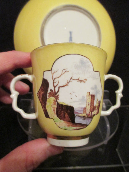 Meissen Yellow Ground Scenic Beaker and Saucer. Dating between 1735 - 1740.